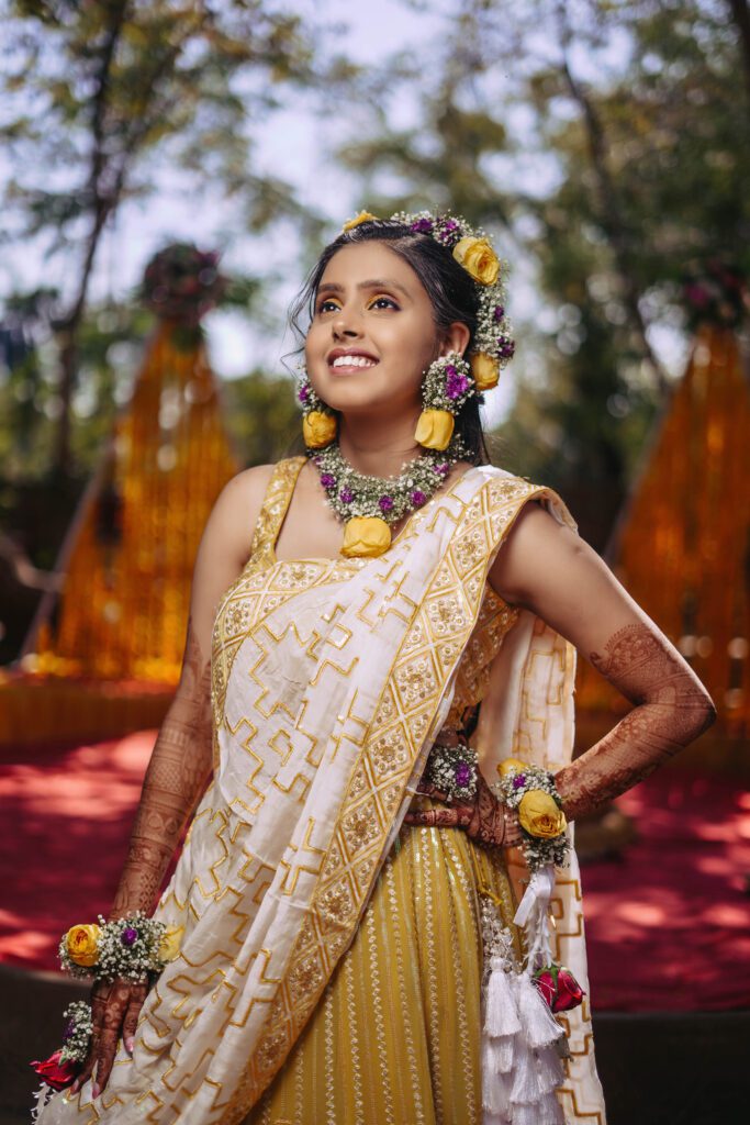 Haldi (Pithi Ceremony) haldi pose in yellow dress and haldi jewellery