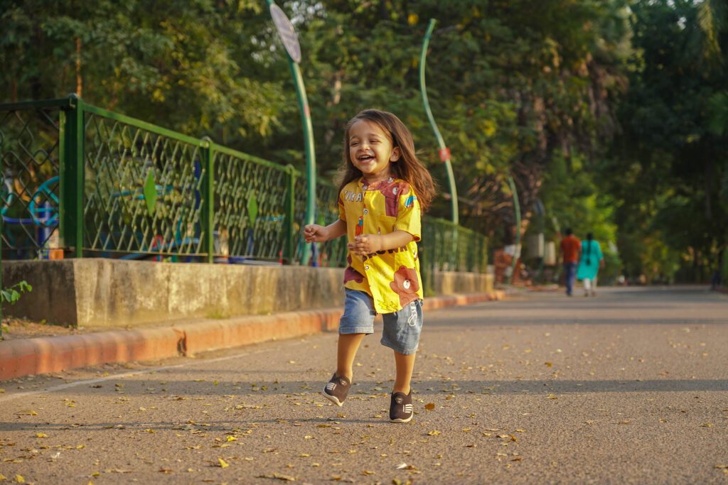 Childrens Photography 2025 10 Children Photography(Childhood Photography) playing in garden and smiling.
