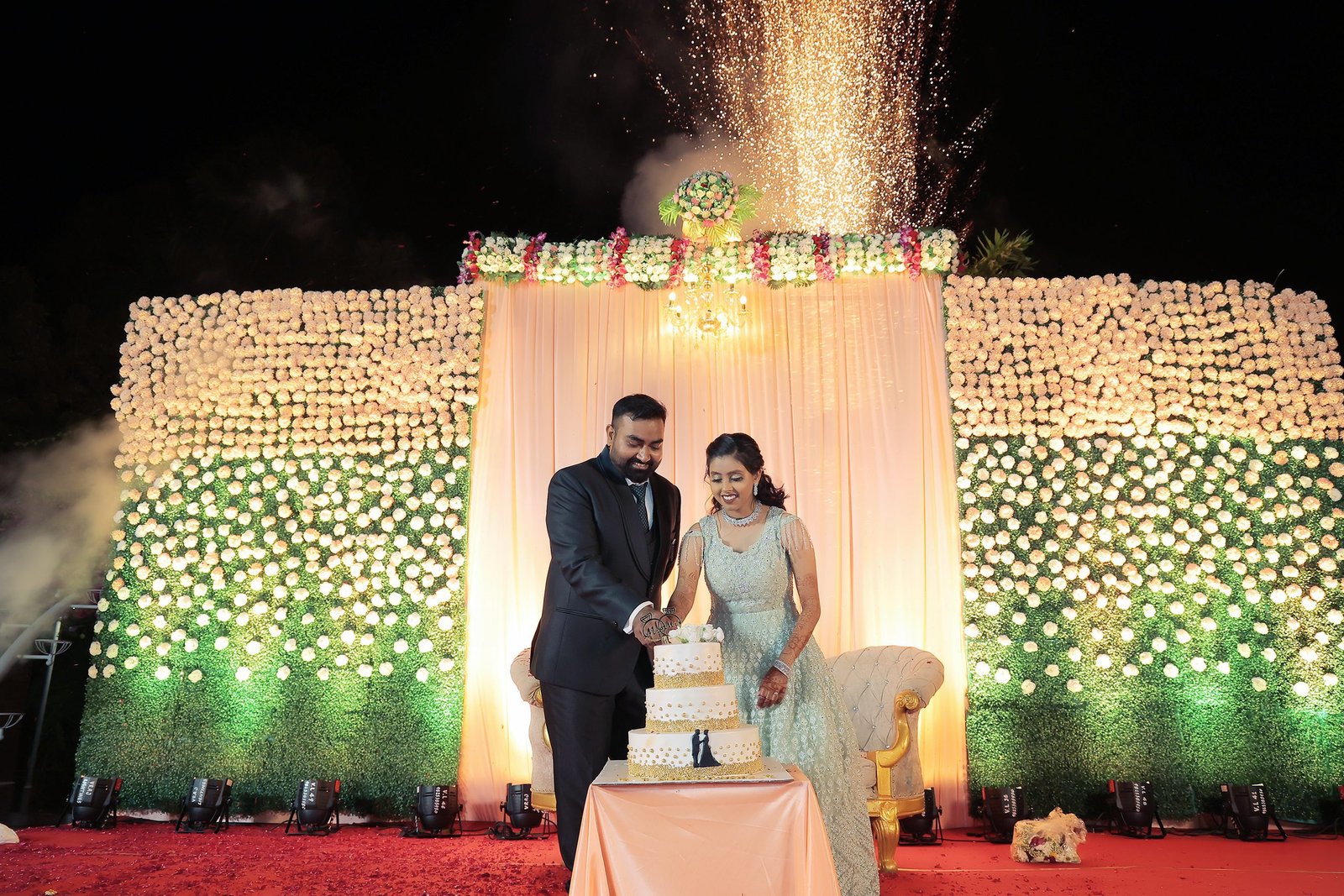 a newly engaged couple cutting thier cake