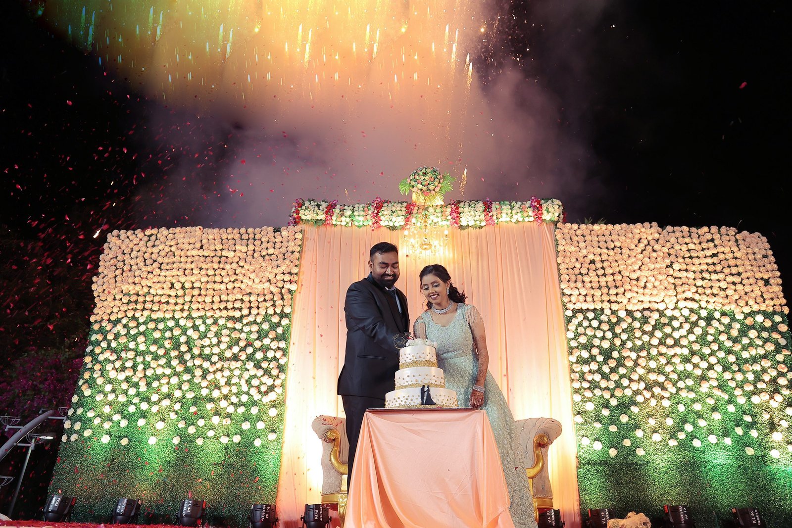 a newly engaged couple cutting thier cake