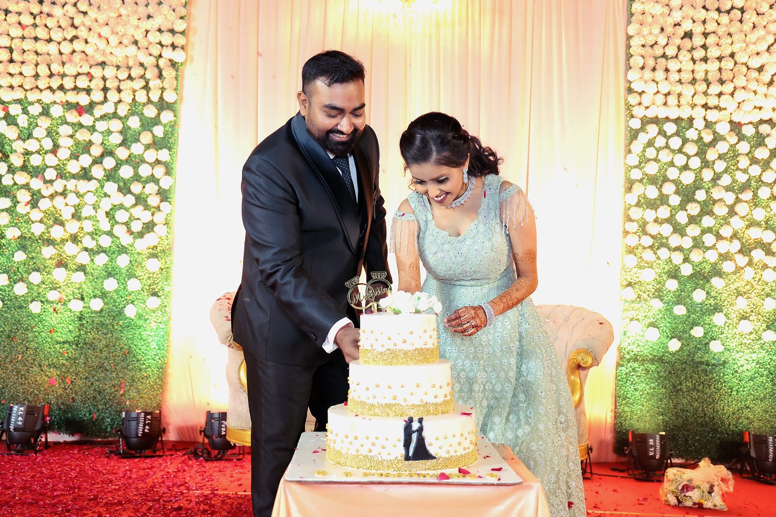 a newly engaged couple cutting thier cake